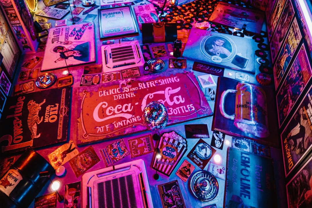 Accueil 1 red coca cola signage surrounded by other signages 1601773